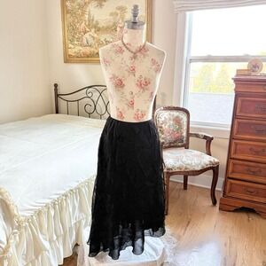 black‎ fairy midi skirt

90s black textured midi skirt Bali size 6